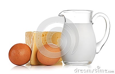 Big piece of cheese, glass jug with milk Stock Photo