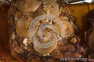 Big Piece of Slow Cooked Oven-Barbecued Pulled Pork shoulder on chopping board with mixed peppercorns, rosemaryn Stock Photo