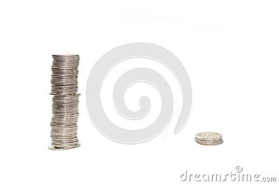 Big pile of coins versus small pile of coins Stock Photo