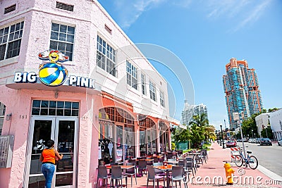 Big Pink retro era restaurant on Collins Avenue with empty table Editorial Stock Photo