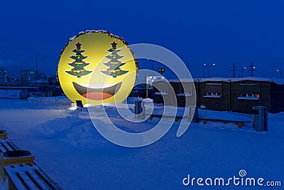 Big poster smiley at the supermarket Surgut City Mall parking, Surgut, Russia - Frbruary 16, 2019 Editorial Stock Photo