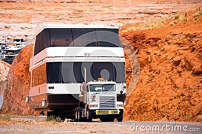 Big powerful rig semi truck down to the water a huge oversize sh Stock Photo