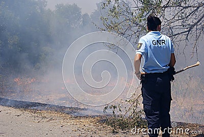 GNR police officers are fighting against the flames Editorial Stock Photo