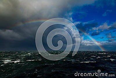 Big Rainbow Over Rough Seas In The English Channel Stock Photo