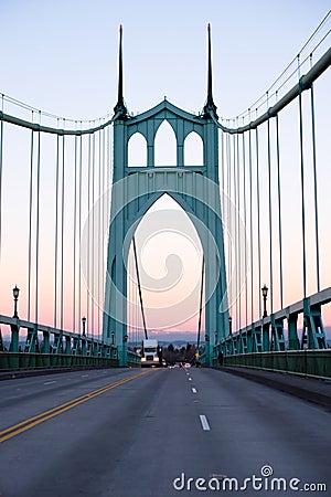 Big rig semi truck running on St Johns bridge in evening twilight Stock Photo