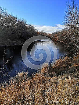 Big river. Trees on the riverbank. Autumn weather. Stock Photo