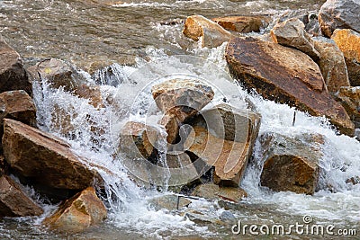 Big Rock Weir, the water overflowing like a waterfall, rural highway Stock Photo