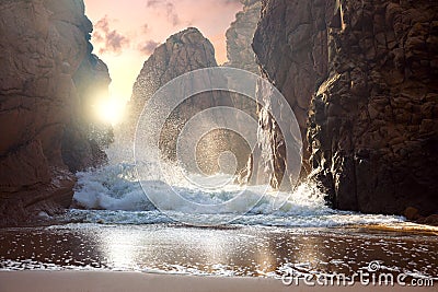 Big rocks and ocean waves at sundown Stock Photo