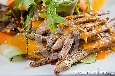 Big salad meal plan strips of roast duck with spicy orange sauce Stock Photo