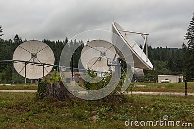 Big satellite dish antennas installed in the rural areas Stock Photo