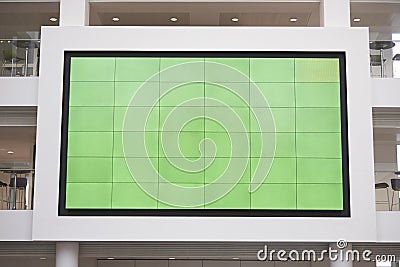 Big screen, AV monitor, in a university lobby atrium Stock Photo