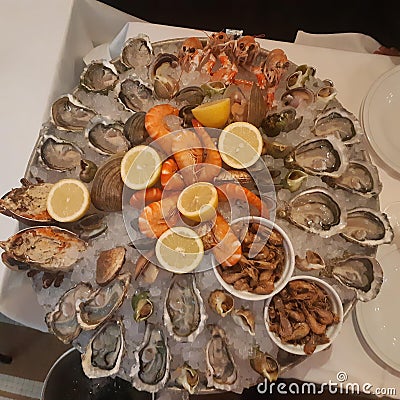 Big seafood shrimp oysters shell lemons Stock Photo