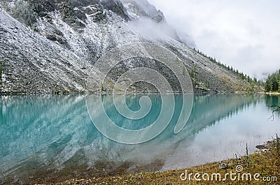 Big Shavlinskoe lake in the summer, foggy in the morning, Altai mountains Stock Photo