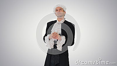 Man dressed in courtier frock coat and white wig thinking and fi Stock Photo
