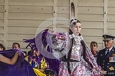 A medium shot of a indigenous teen talent showcase, wearing a purple traditional cloths Editorial Stock Photo