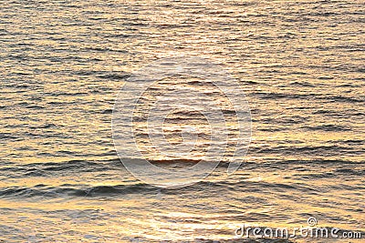 Ocean Morning Waves with Sun Glistening Stock Photo
