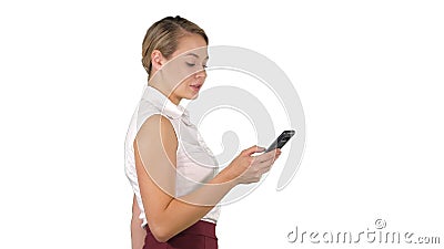 Half length portrait of young businesswoman looking at her phone on white background. Stock Photo