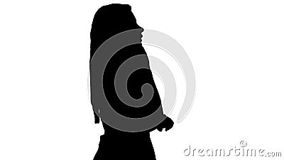 Silhouette Lovely woman walking and talking on the phone. Stock Photo