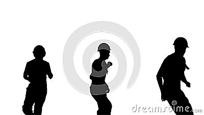 Silhouette Three male construction workers in hard hats dancing Stock Photo