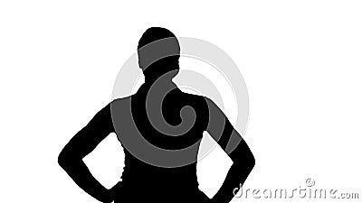 Silhouette Confident young pretty waitress walking with hands on hip. Stock Photo