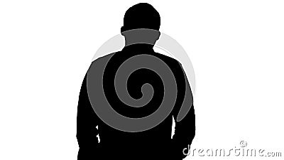 Silhouette Young man walking and whistling. Stock Photo