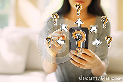 Big and small question marks with arrows with woman using a smar Stock Photo