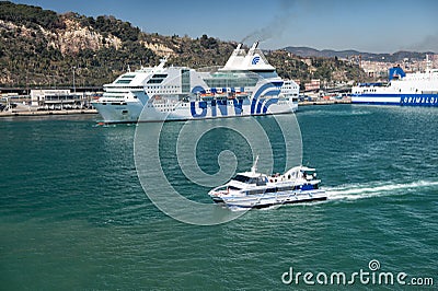 Big and small ships enter port Editorial Stock Photo