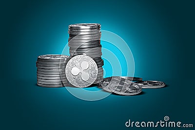 Big stack of Ripple coins XRP on gently lit cyan background. Editorial Stock Photo