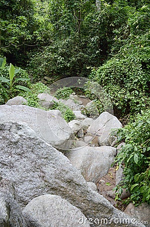 Big stone in chan ta then waterfall Stock Photo