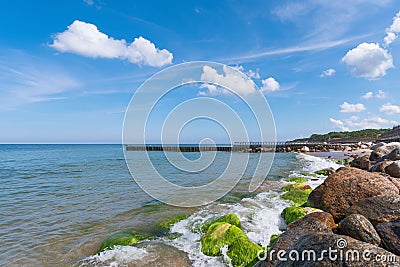 City Pionersky, Kaliningrad region. big stones and wooden breakwaters protect the coast of the Baltic Sea. Stock Photo