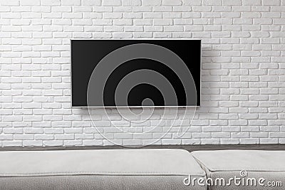 Big TV on the white wall Stock Photo