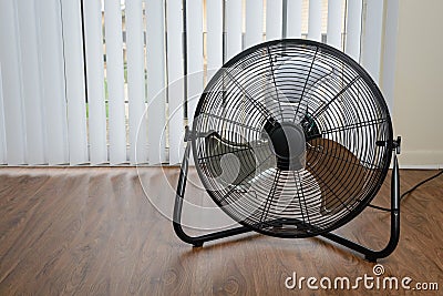 Big ventilation fan on wooden floor Stock Photo