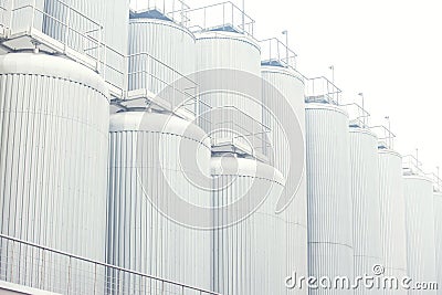 Big vine barrels. Contemporary large steel barrels in winery. Vine industry Stock Photo