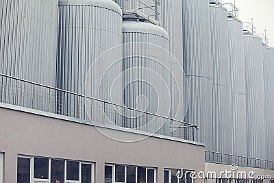 Big vine barrels. Contemporary large steel barrels in winery. Vine industry Stock Photo