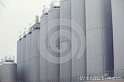 Big vine barrels. Contemporary large steel barrels in winery. Vine industry Stock Photo