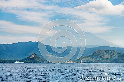 Big volcano rise over the island and sea Stock Photo