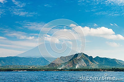 Big volcano rise over the island and sea Stock Photo
