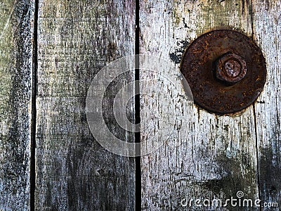 Big washer in rusty time an old antique wooden texture picture background in realistic Stock Photo