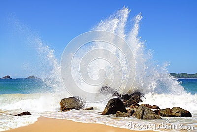 Big wave crashes on to the shore. Stock Photo