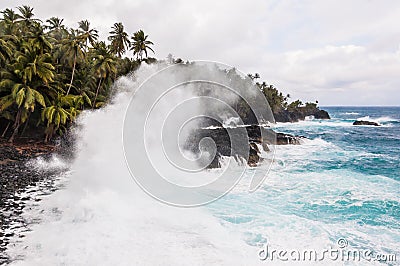 Big waves crushing on the shore of a tropical island Stock Photo