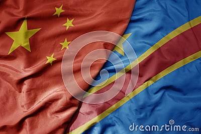 big waving national colorful flag of china and national flag of democratic republic of the congo Stock Photo