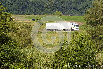 Truck rides way out in the field. Stock Photo