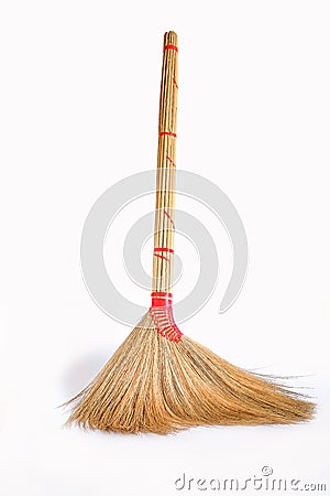 Big yellow broom sweep floor with long wooden . Stock Photo