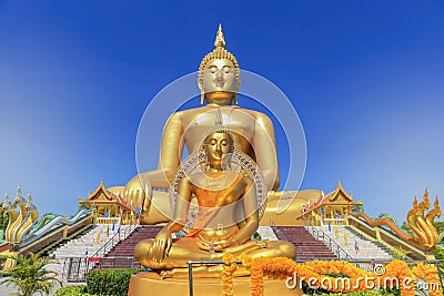 biggest golden buddha statue in wat muang public temple at angthong province, thailand Stock Photo
