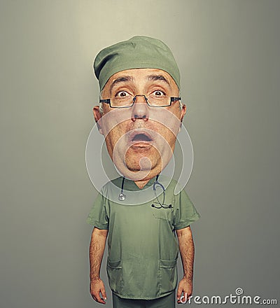 Bighead amazed doctor in glasses and uniform Stock Photo