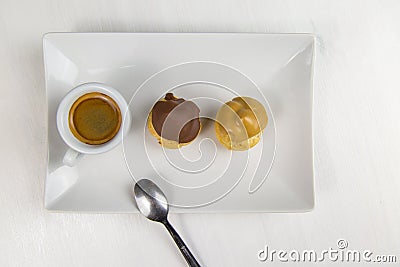 BignÃ¨ and coffee on white dish Stock Photo