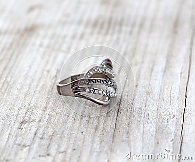 bijoux ,used ring with gems on wood background Stock Photo