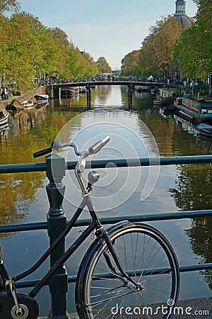 Bike and canal in Amsterdam Stock Photo