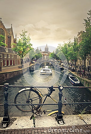 A bike and a canal in Amsterdam Stock Photo