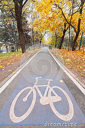 Bike cycling traffic sings on a track from the middle of a park Stock Photo
